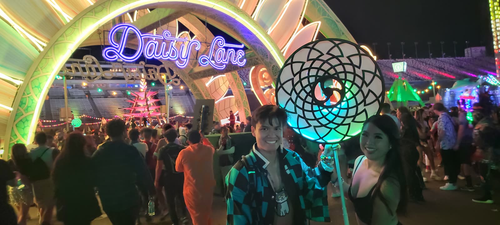 Holding the lit totem at a festival