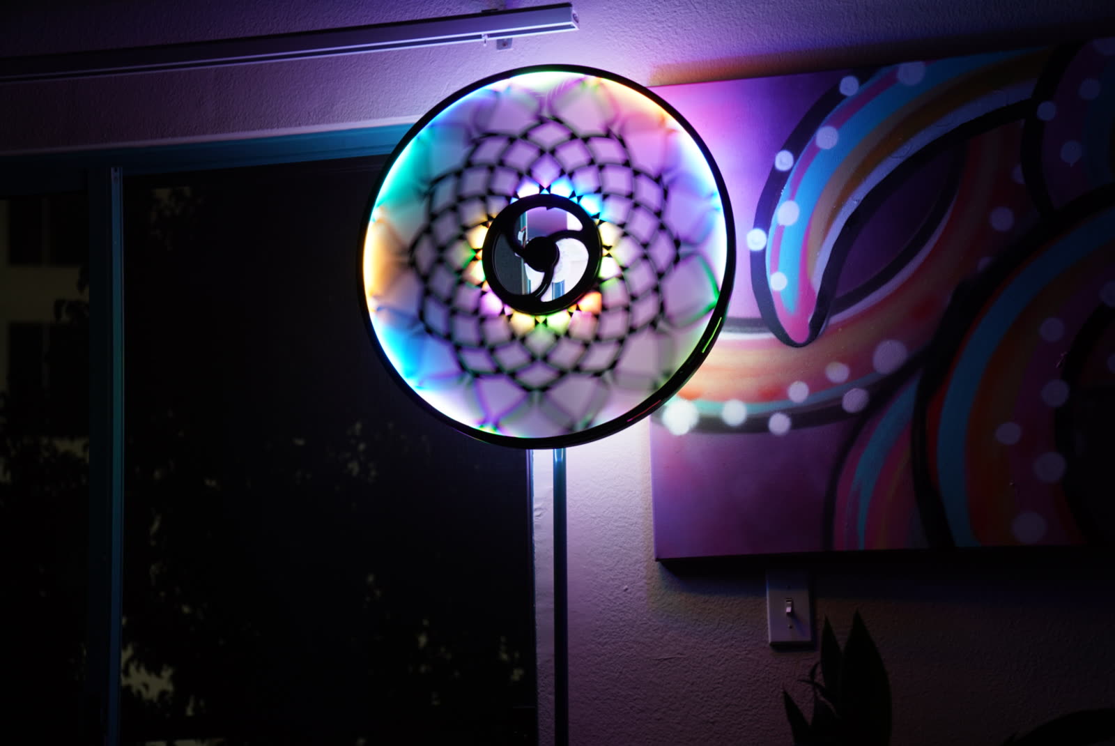 The totem glowing against a wall at home