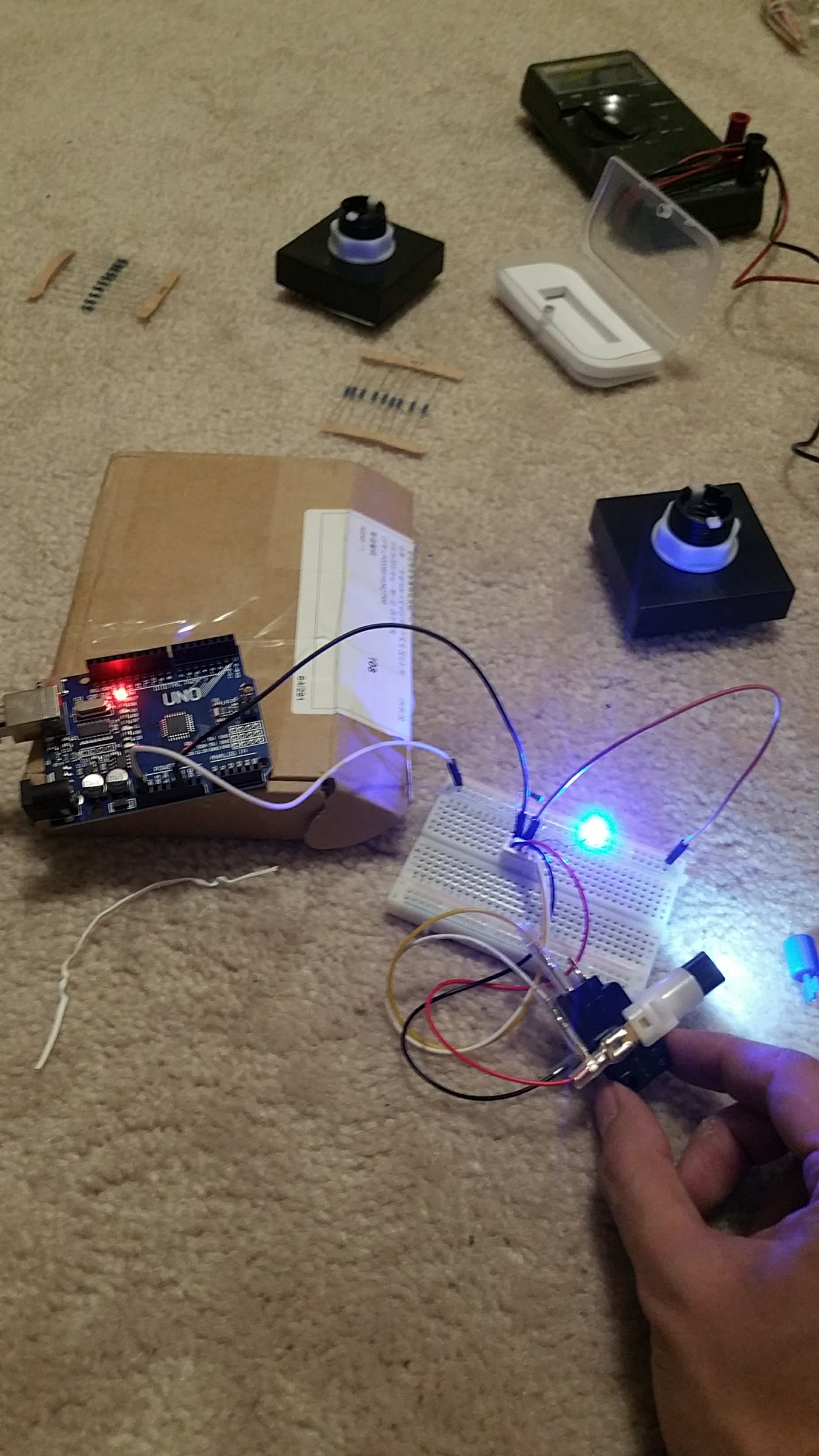 Testing a lit arcade button on a breadboard